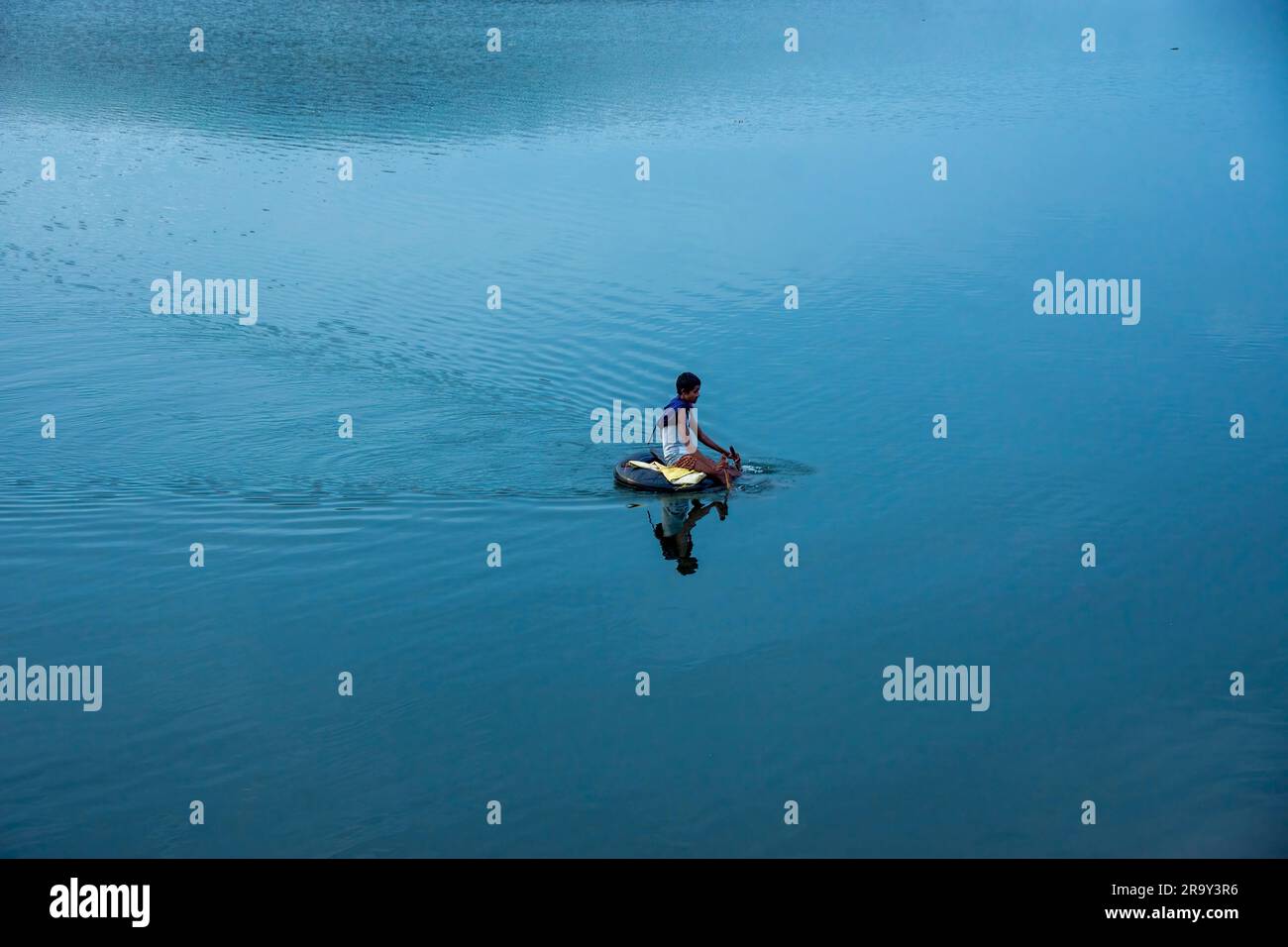 fisherman fishing in unique way in india Stock Photo