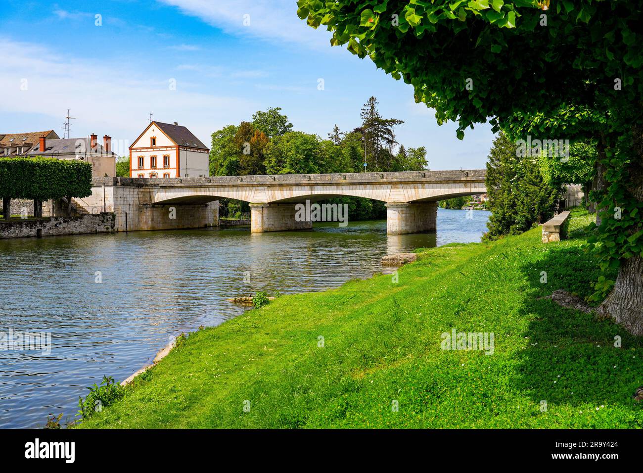 Marne Riiver View of the Bridge of Fraternity spanning the Loing river in Nemours, a ...