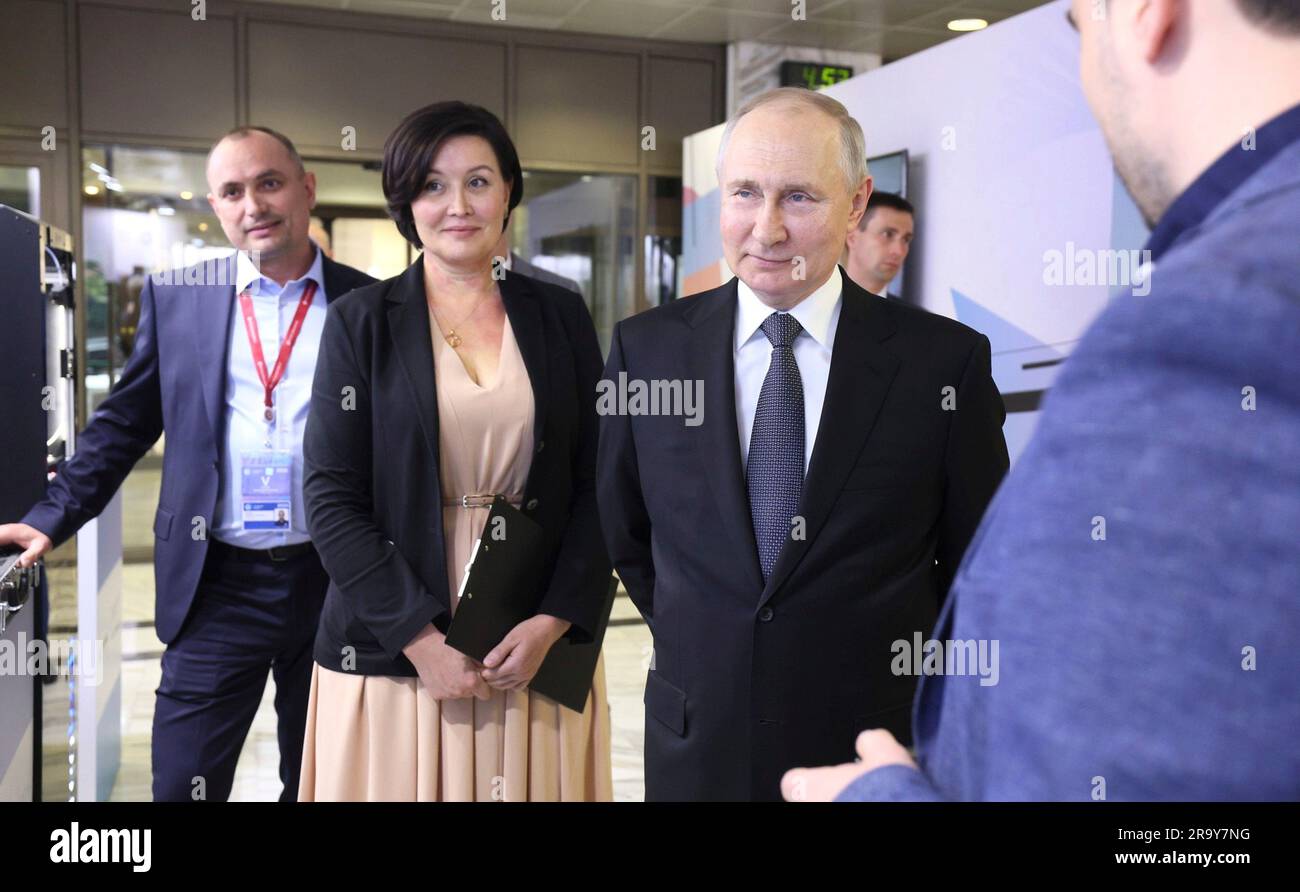 Moscow, Russia. 29th June, 2023. Russian President Vladimir Putin, right, tours an exhibition of Russian brands with ASI General Director Svetlana Chupsheva, center, before the plenary session of the Strong Ideas for a New Time forum, June 29, 2023 in Moscow, Russia. The exhibit displayed products rebranded to replace popular Western products banned after the Russian invasion of Ukraine. Credit: Gavriil Grigorov/Kremlin Pool/Alamy Live News Stock Photo