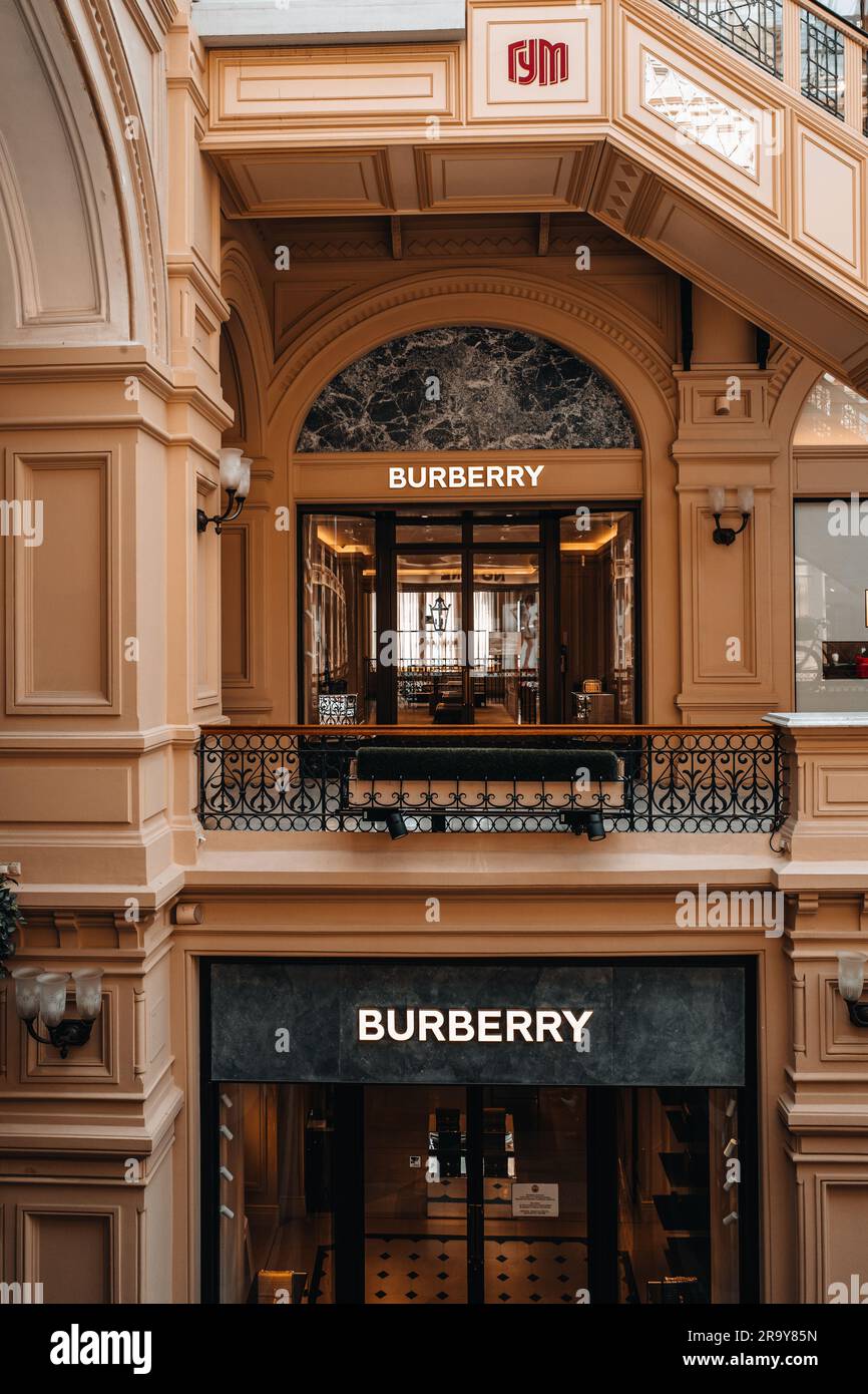 Beige classy facade of Burberry boutique inside the famous shopping mall in Moscow GUM. Burberry is a luxurious clothing brand based in Great Britain Stock Photo