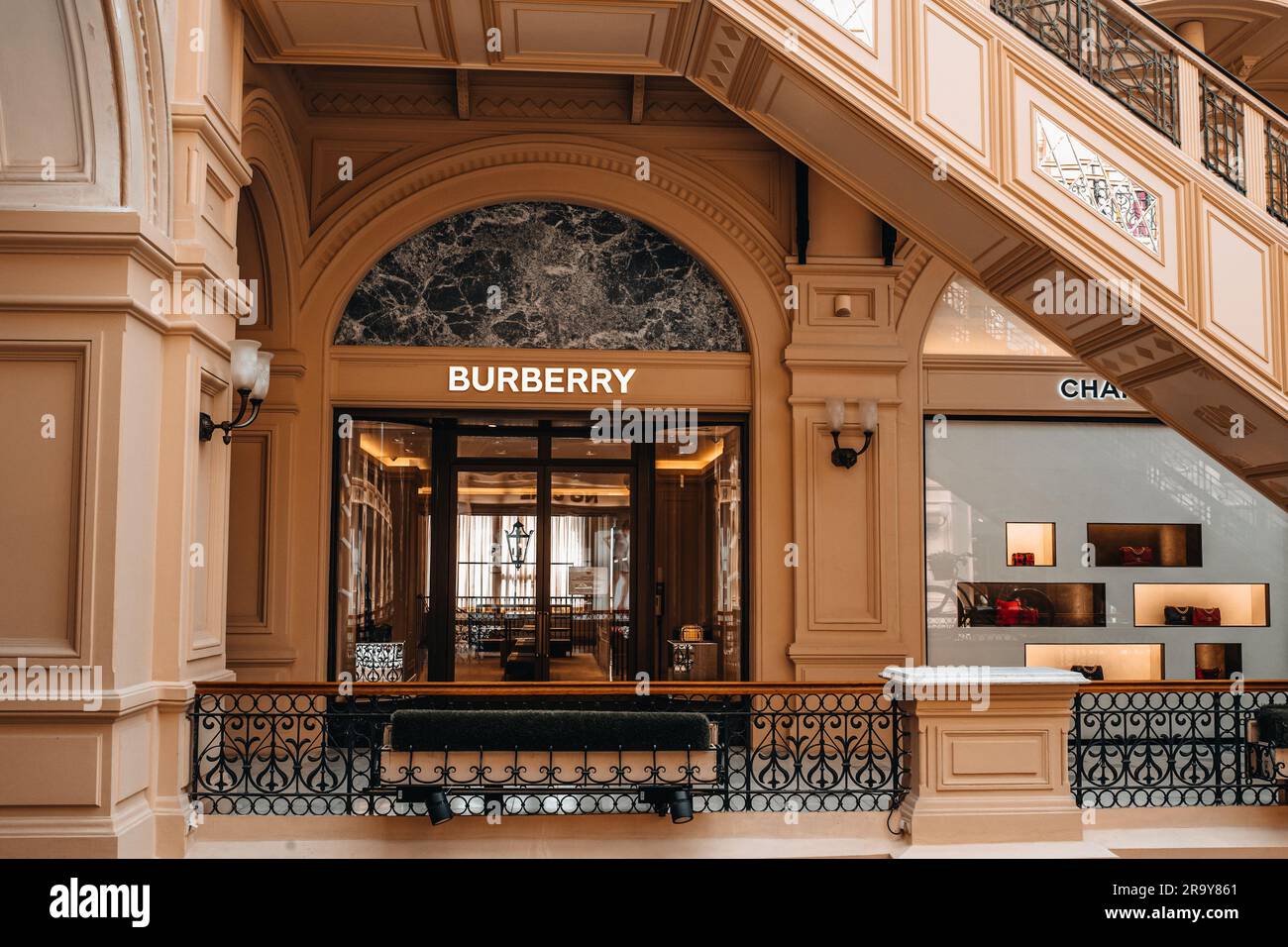 Beige classy facade of Burberry boutique inside the famous shopping mall in Moscow GUM. Burberry is a luxurious clothing brand based in Great Britain Stock Photo