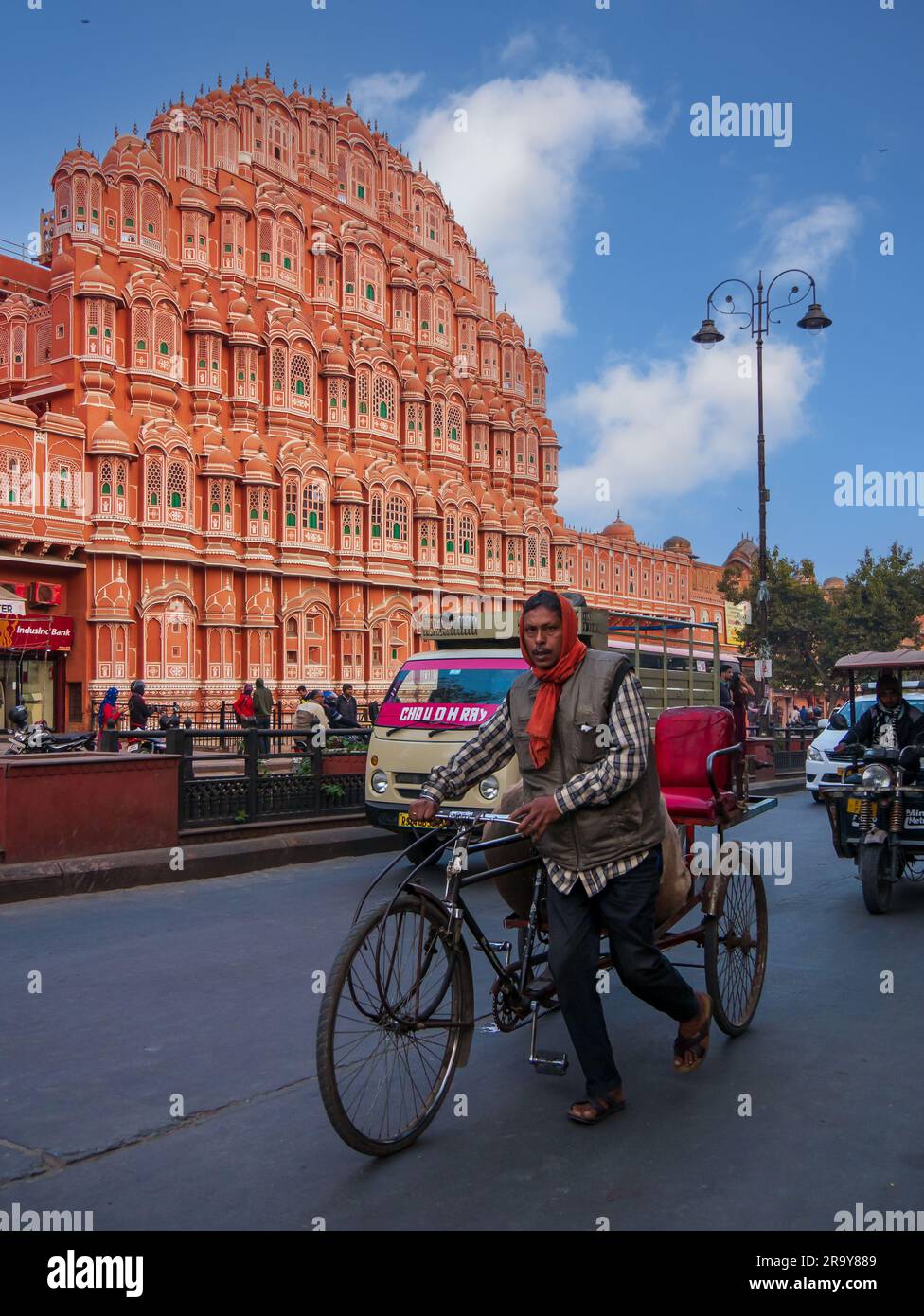 Jaipur, India - December 20, 2022: bicycle taxi  is most common transport of Jaipur near Hawa Mahal, one of the popular tourist destination Stock Photo