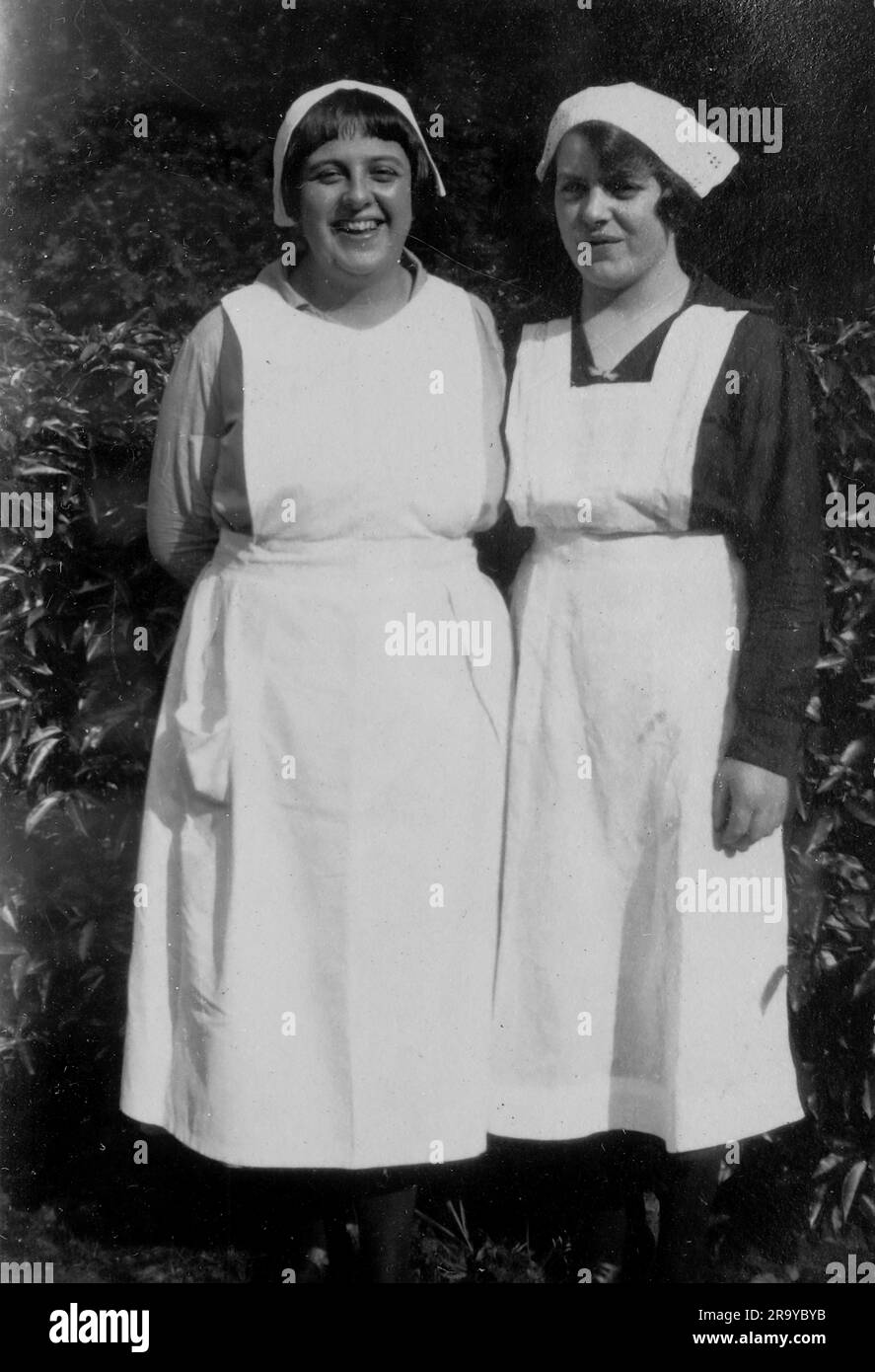 Portrait picture of two nurses in uniform. Photo from a family album of snapshot images mainly taken in the UK, during the 1920s. The family lived in Witley, Surrey, and had some links to the military. Stock Photo