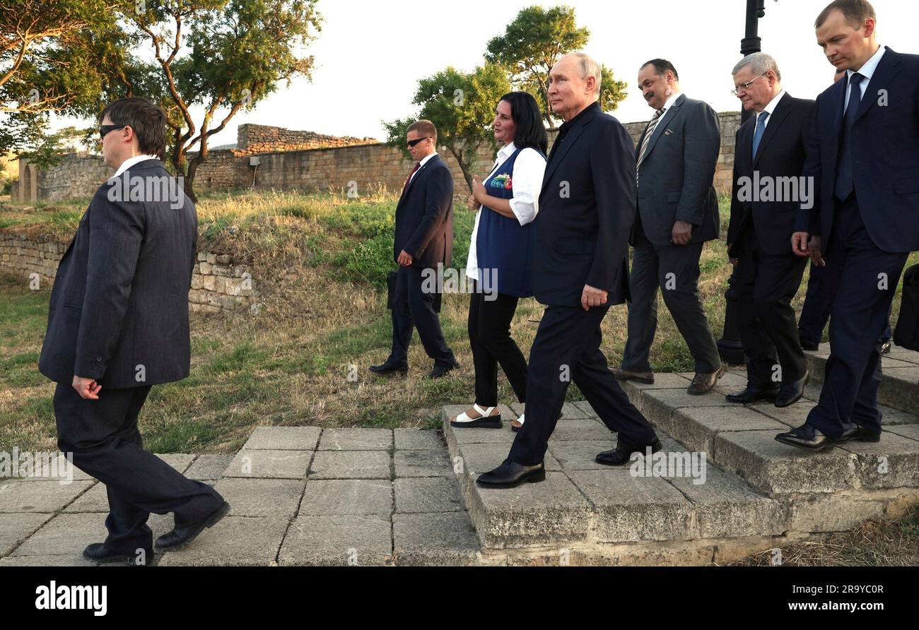 Derbent, Russia. 28th June, 2023. Russian President Vladimir Putin tours the archaeological complex of the Naryn-Kala citadel escorted by guide Kabutar Talibov, left, during a working trip to Dagestan, June 28, 2023 in Derbent, Republic of Dagestan. The UNESCO Heritage site was built in the 6th century by Persian ruler Khosrov I from the Sasanian dynasty. Credit: Gavriil Grigorov/Kremlin Pool/Alamy Live News Stock Photo