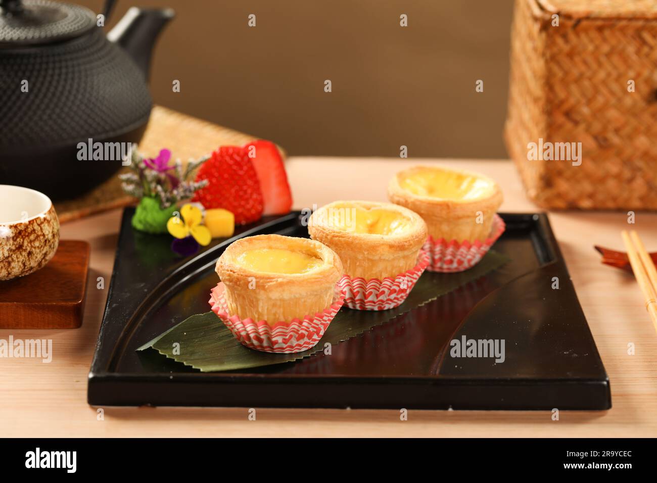 yumcha, dim sum,Egg Tarts,A flaky pastry crust filled with creamy egg custard. Daan Taat Stock Photo