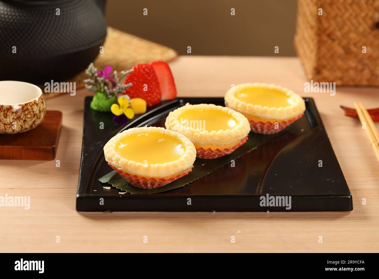yumcha, dim sum,Egg Tarts,A flaky pastry crust filled with creamy egg custard. Daan Taat Stock Photo