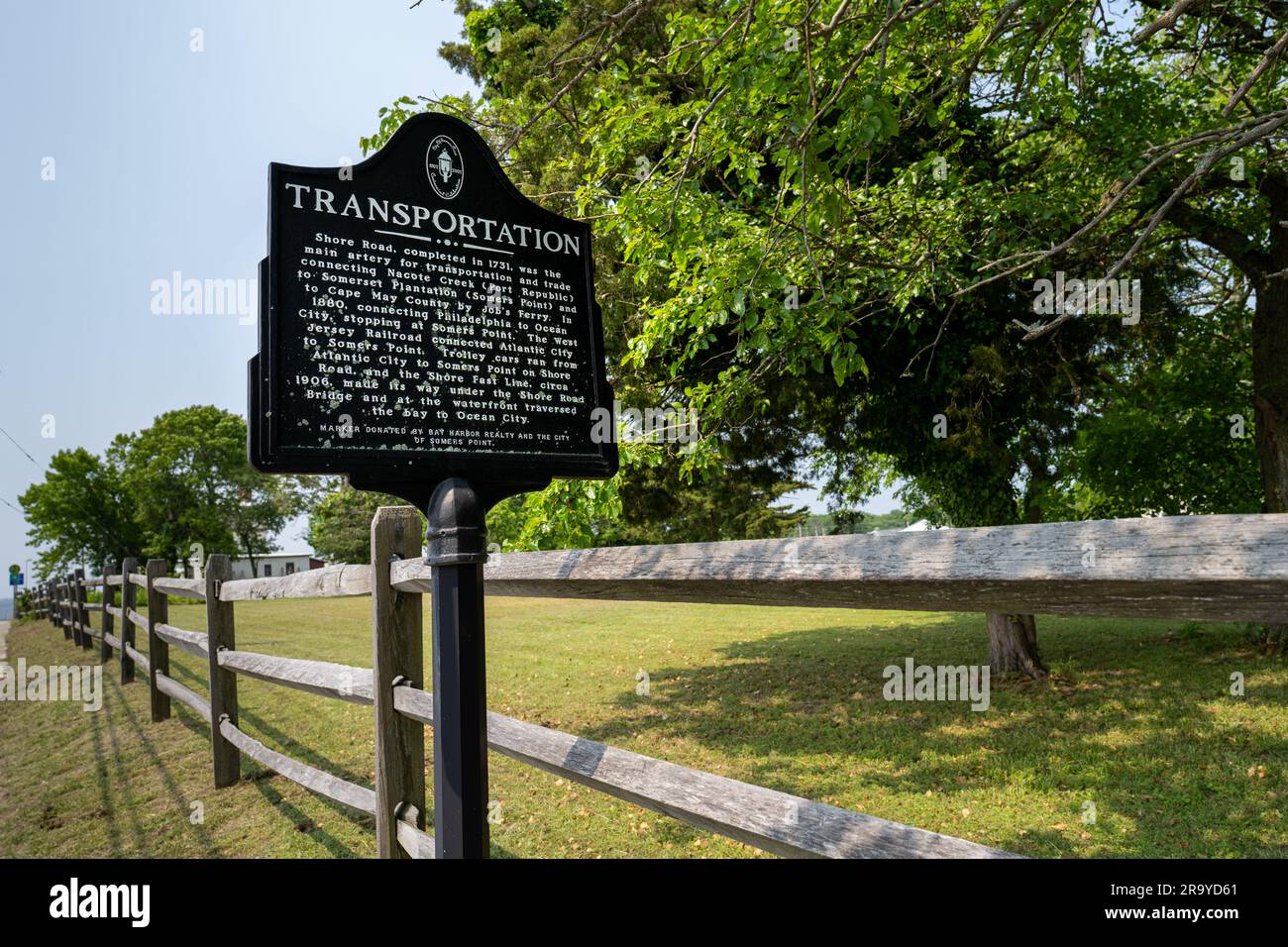Somers Point, NJ - May 22, 2023: This plaque tell the history of various forms of transportation available in the area. Stock Photo