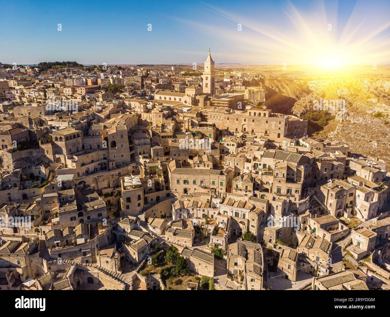 Aerial view of medieval city of Matera Sassi di Matera in beautiful golden morning light at sunrise. Birds view of Sassi di Matera, in Basilicata, sou Stock Photo
