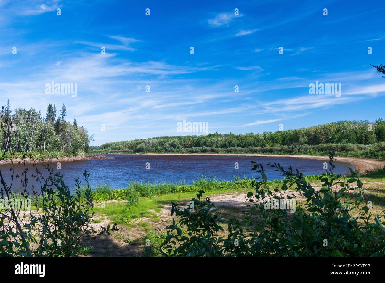 Hay River flowing quietly, Northwest Territories, Canada Stock Photo