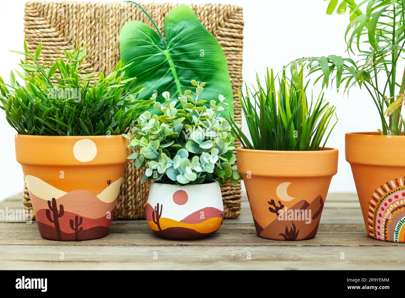 Artificial plants in clay terracotta pots. Hand painted with acrylics