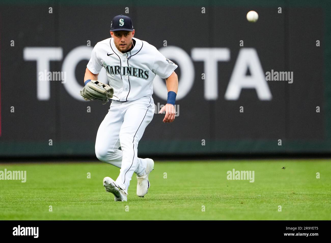 Seattle Mariners left fielder Jarred Kelenic watches as the ball bounces  over the wall for a ground-rule double by Detroit Tigers' Zach McKinstry  during the third inning of a baseball game, Saturday