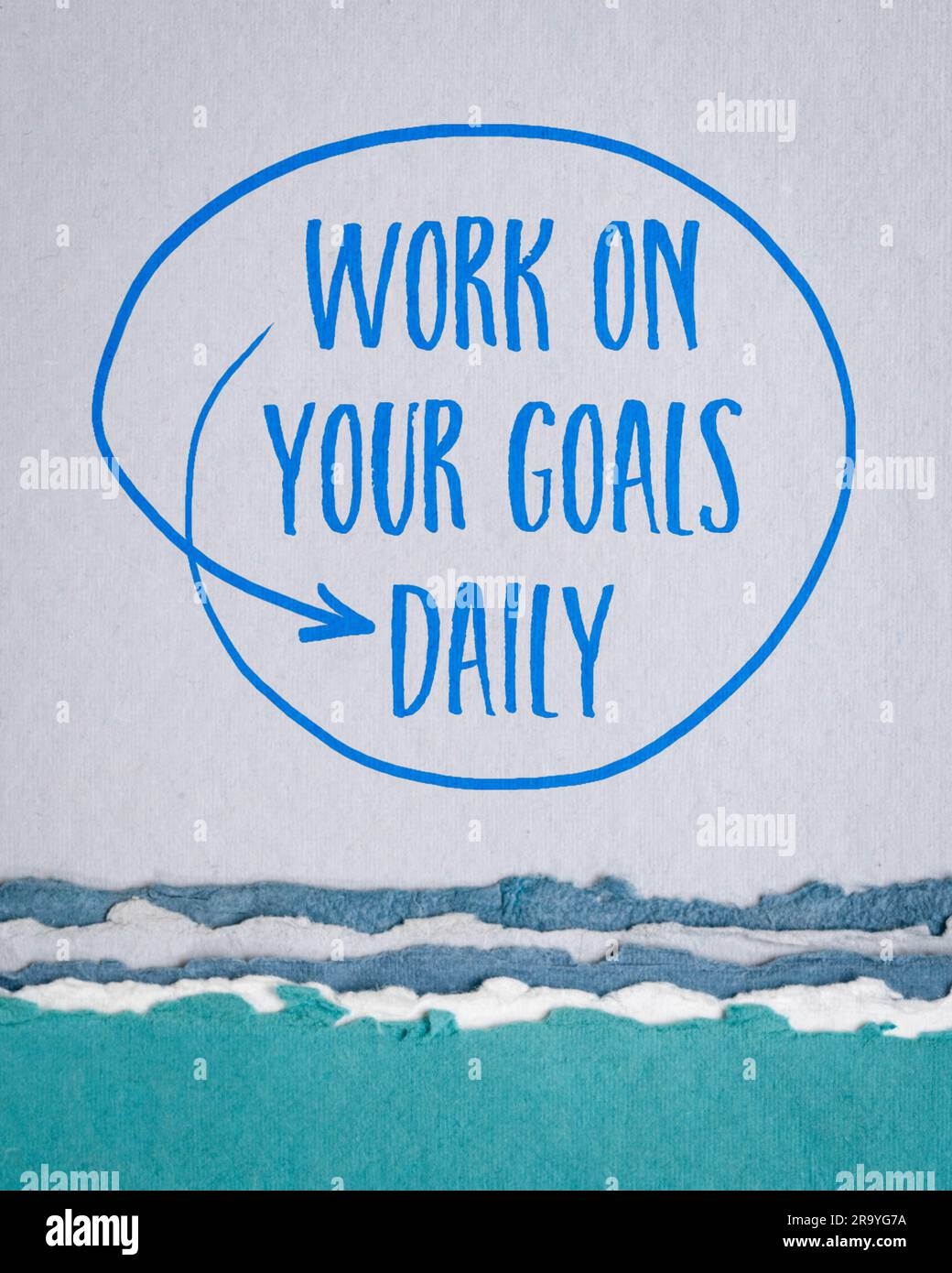 work on your goals daily - motivational reminder, handwriting on art paper, goal setting, business and personal development concept Stock Photo