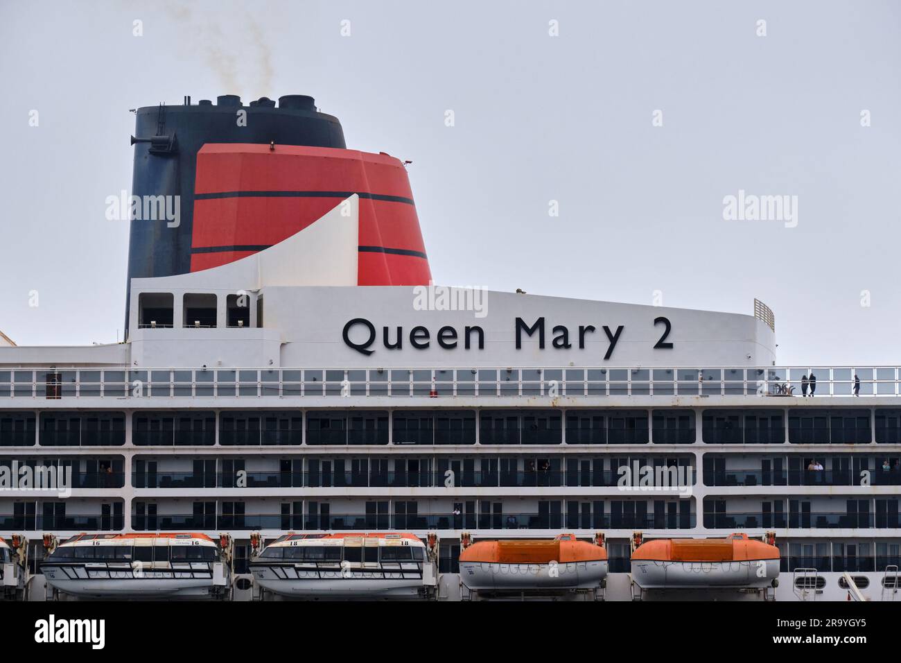 The Ocean Line Queen Mary 2 name of the side of the ship Stock Photo