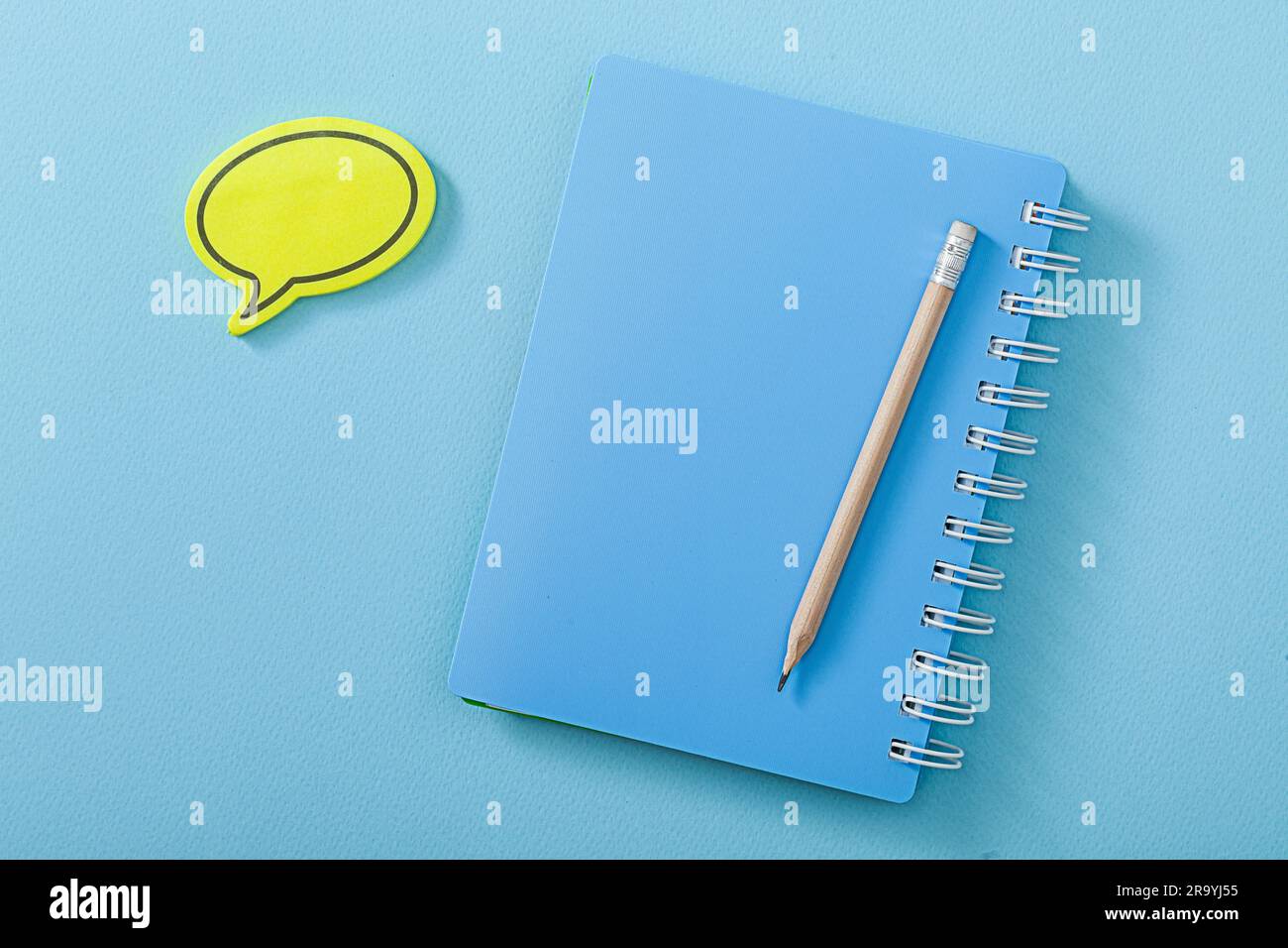 Blue Notepad Pencil And Notestick With The Form Of Message Stock Photo ...