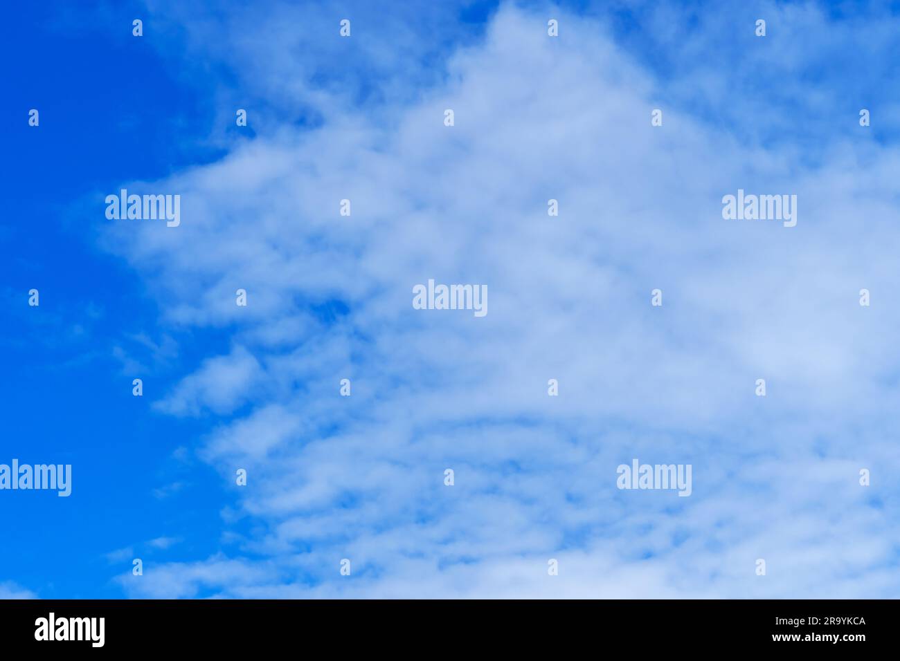 Beautiful cirrus clouds on a blue summer sky Stock Photo