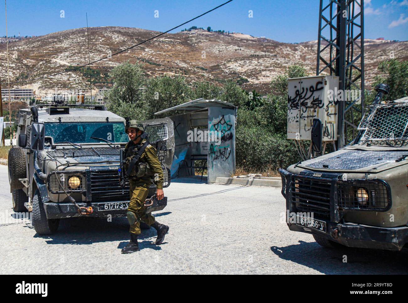 Nablus, Palestine. 29th June, 2023. An Israeli soldier guards the ...