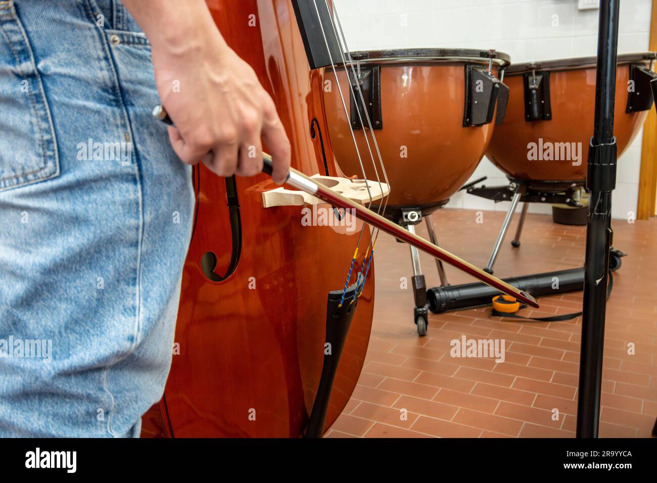 Real life young music students during rehearsals. Musical instruments