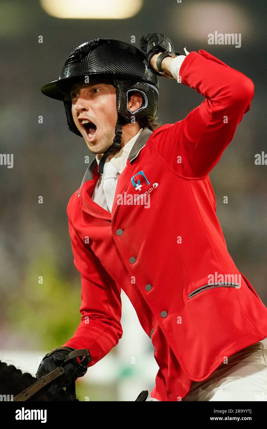 Aachen, Germany. 29th June, 2023. Equestrian sport, jumping: CHIO, Show Jumping, Nations Cup. The show jumper Martin Fuchs from Switzerland on the horse Commissar cheers about the victory. Credit: Uwe Anspach/dpa/Alamy Live News Stock Photo