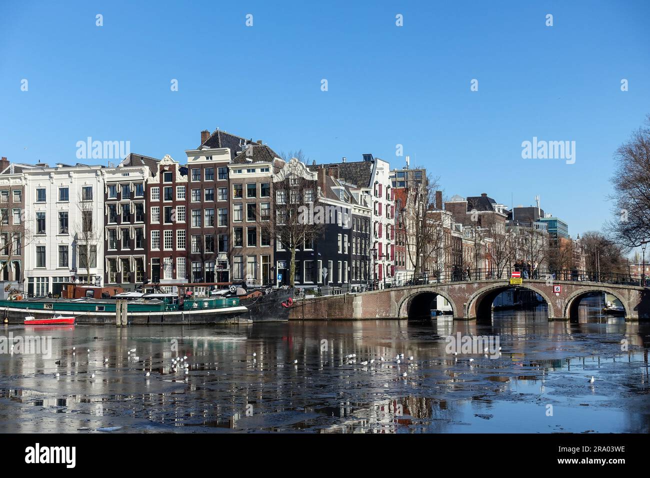 Frozen canals in the city center of Amsterdam, Netherlands Stock Photo