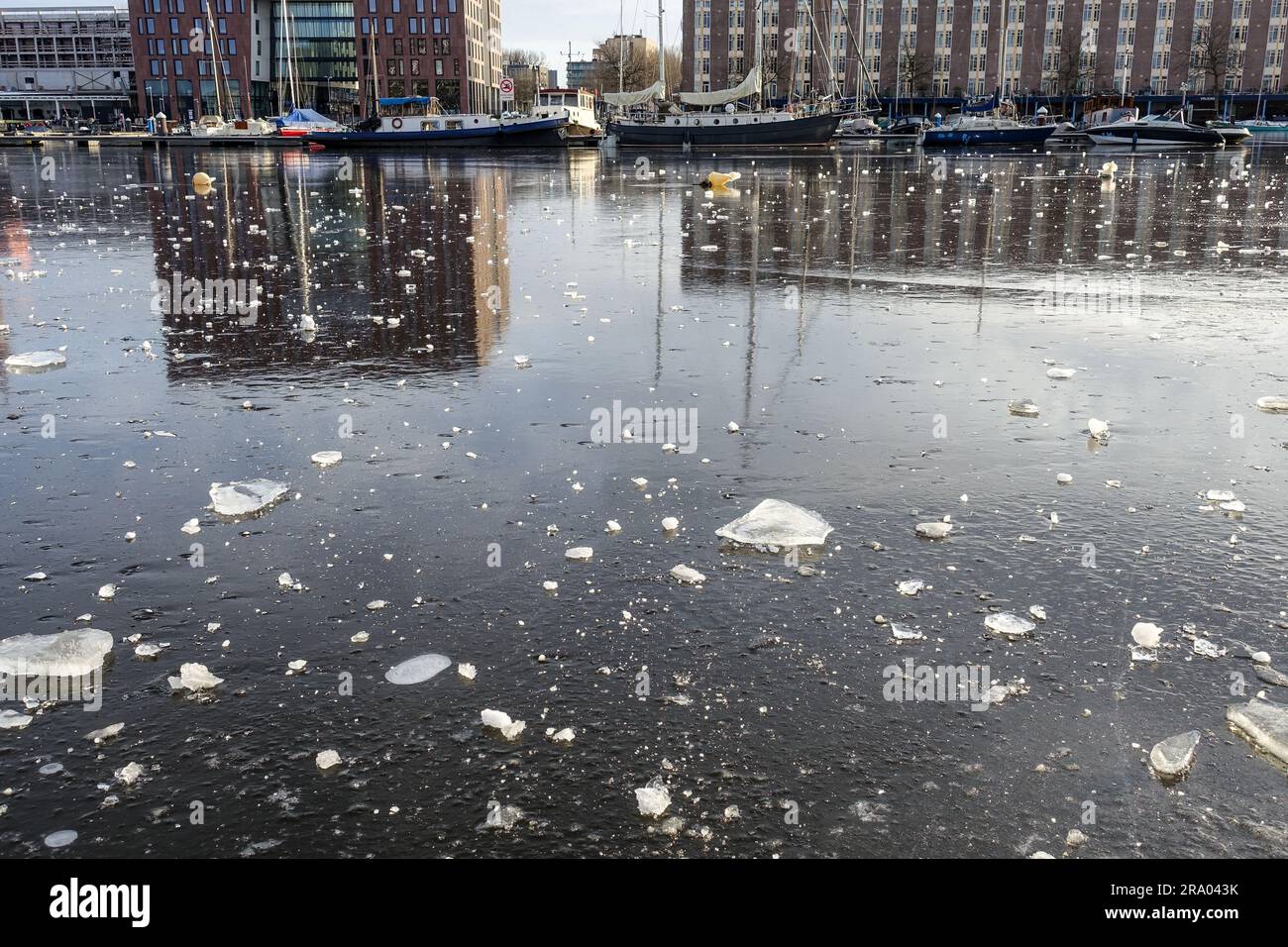 Ice blocks over a frozen canal in Amsterdam, Netherlands Stock Photo