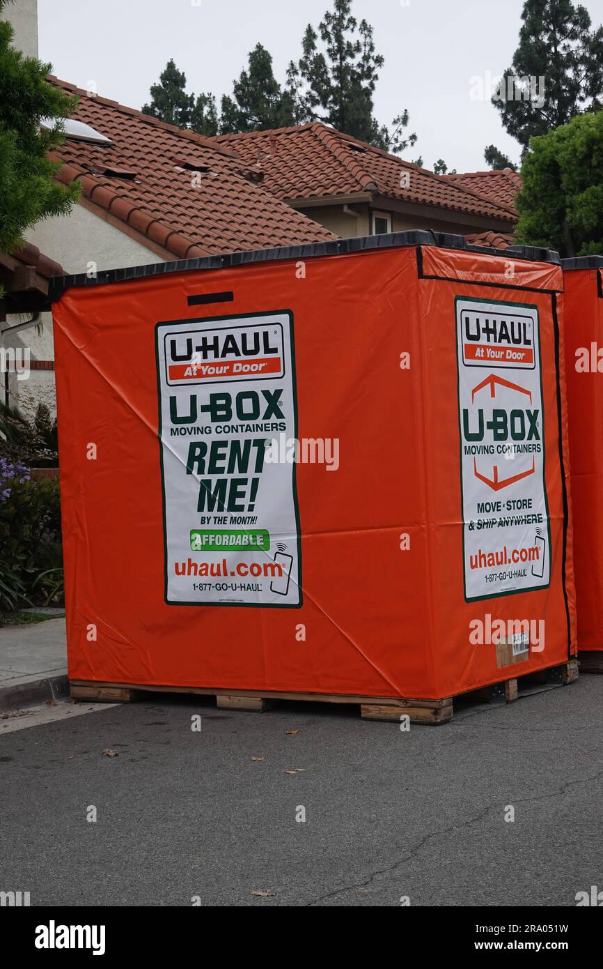 U Haul u-box portable storage pods and moving containers outside a home in California 18th June 2023 Stock Photo