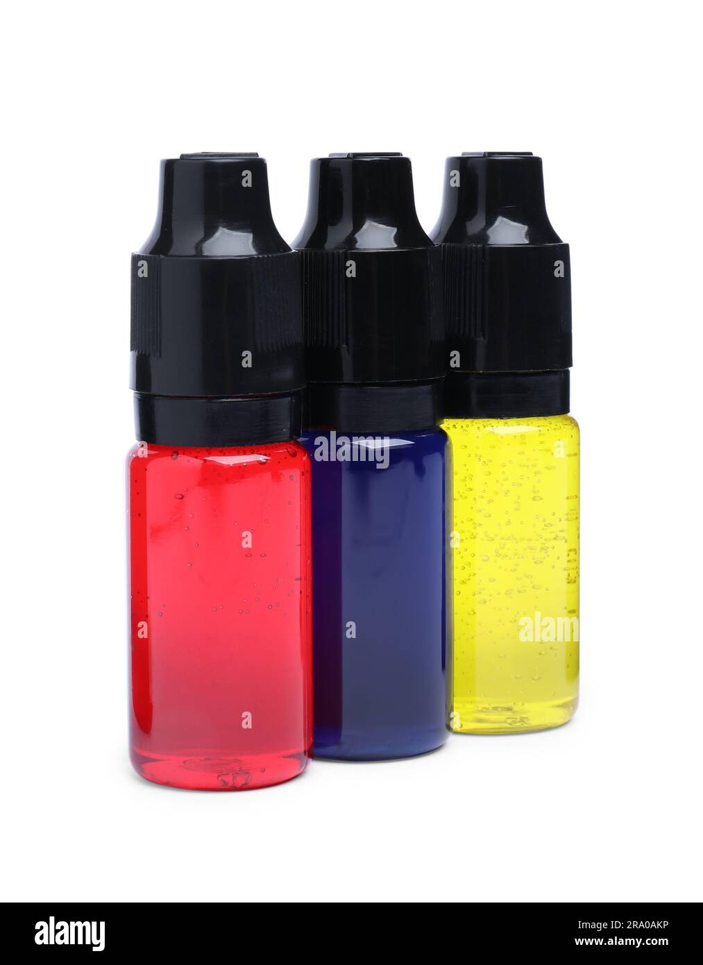 Bottles with different food coloring on white background Stock Photo