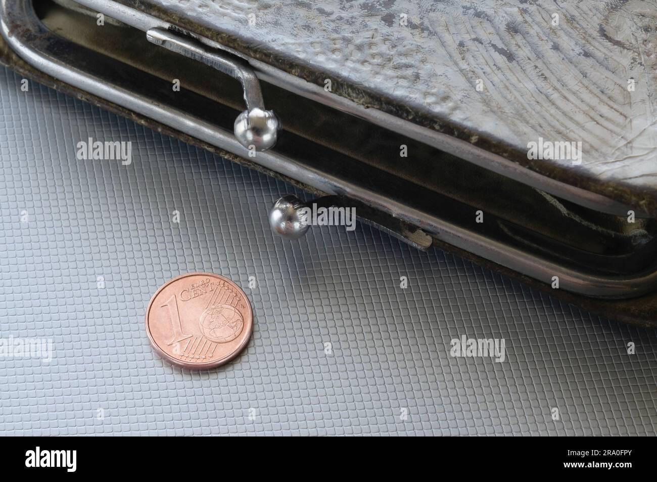An open wallet and one cent of euro, to symbolize poverty, bankrupt Stock Photo