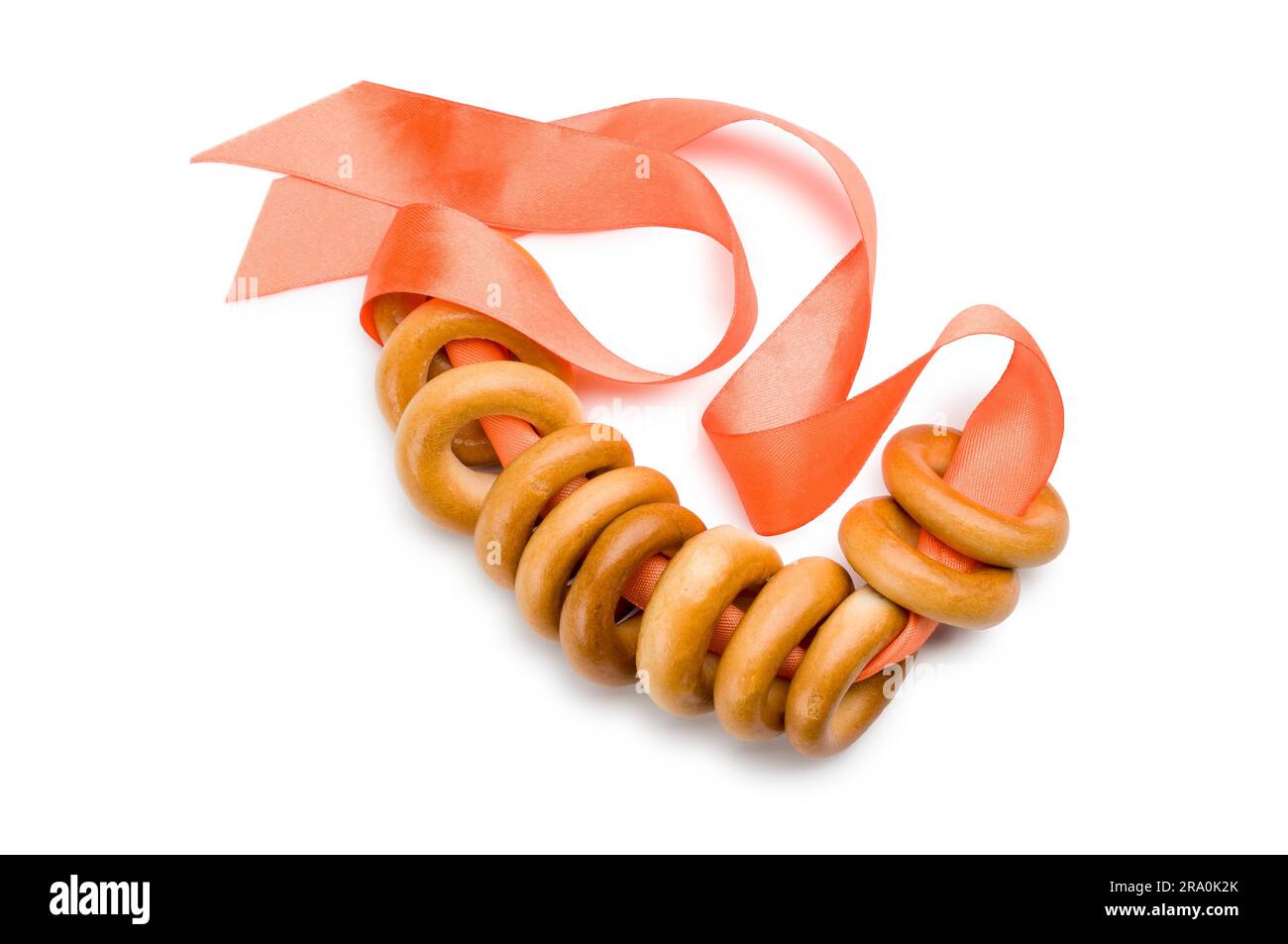 Bublik from Russia or Ukraine with an orange ribbon isolated on white background Stock Photo