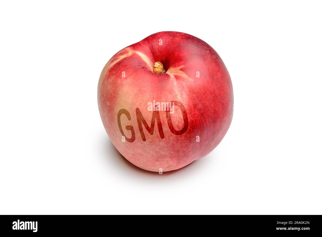A nectarine contaminated by the use of GMO technology Stock Photo
