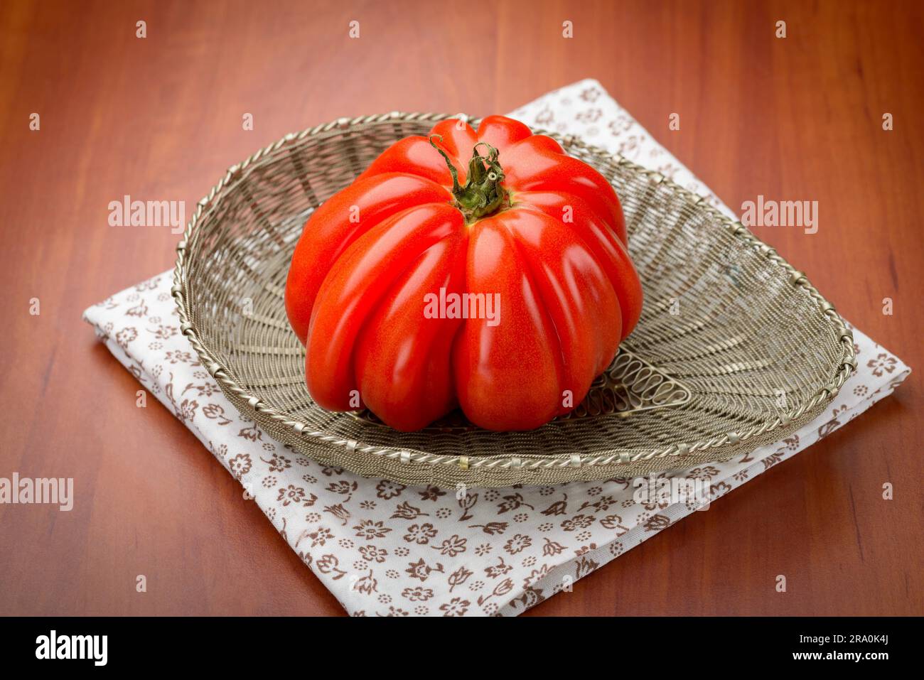 Nice Beef Heart tomato, Olena Ukraina, shown in a silver filigree ...