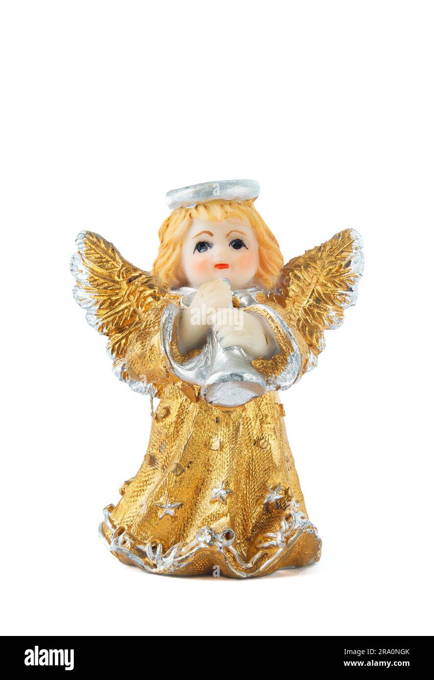 A little miniature statue of a colorful angel with wings and halo, playing the trumpet Stock Photo