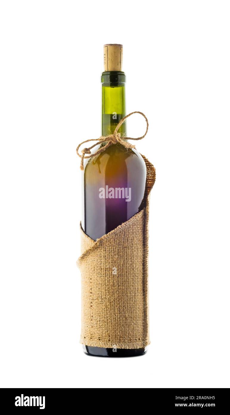 A bottle full of red wine with a rustic jute sheath Stock Photo
