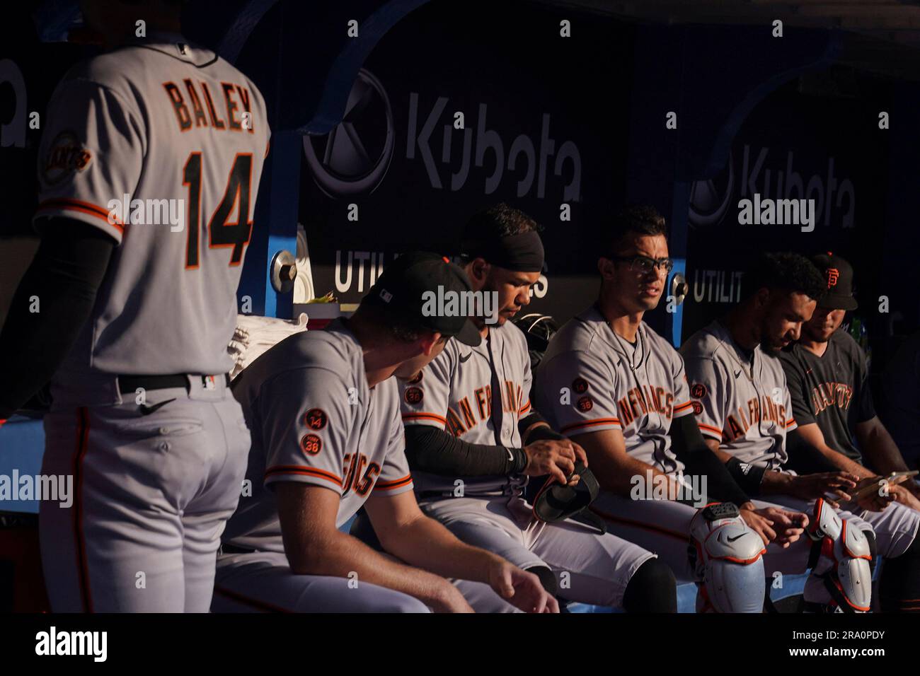 San Francisco Giants players sit in the dugout prior before a baseball game  against the Toronto Blue Jays on Thursday, June 29, 2023, in Toronto.  (Chris Young/The Canadian Press via AP Stock