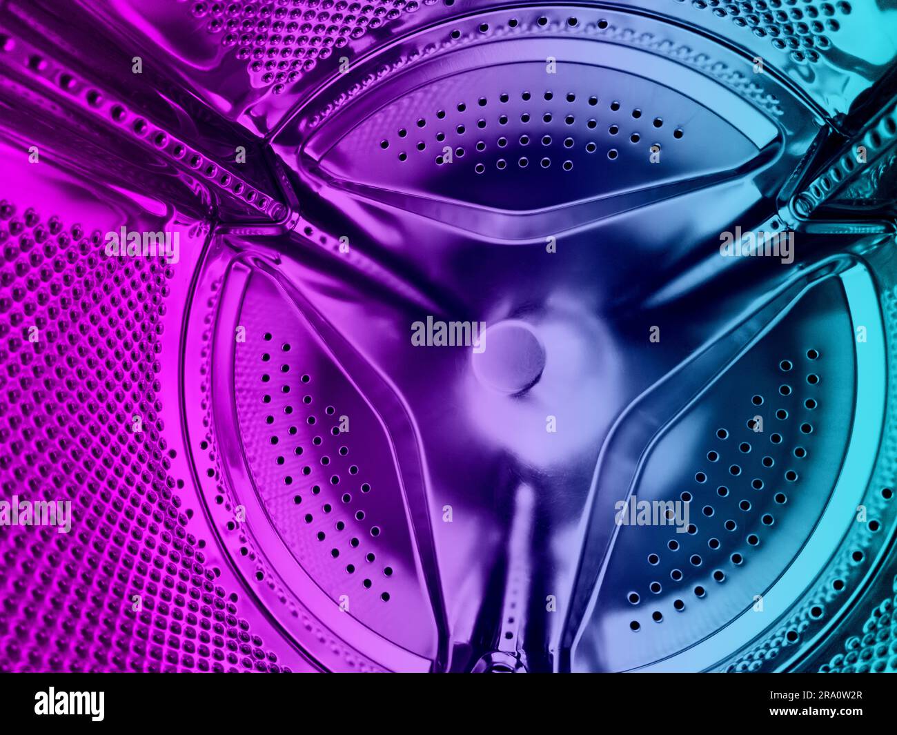 Washing machine drum close up. Washing machine background. Inside the