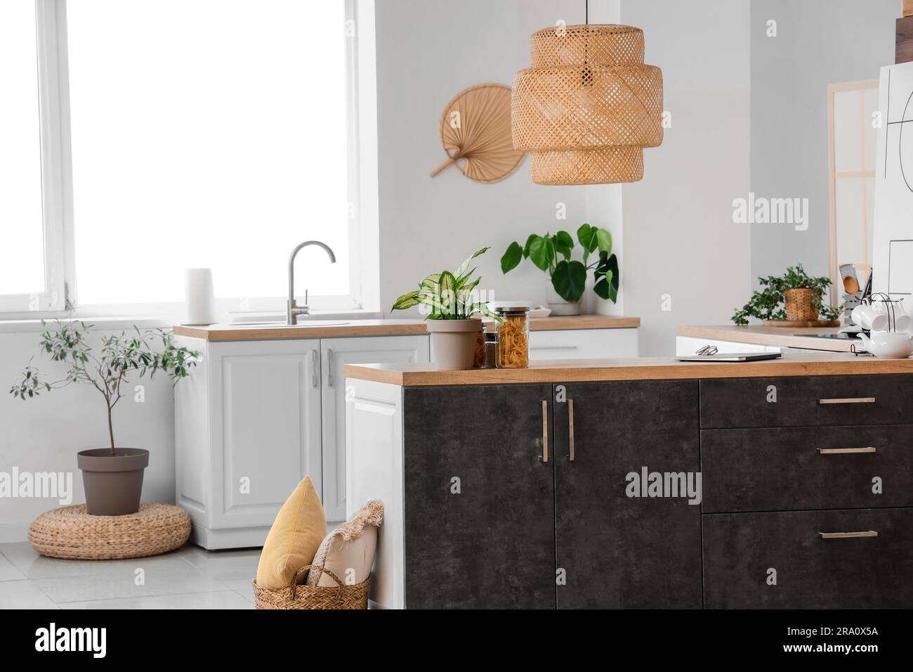 Interior of light kitchen with white and grey counters Stock Photo - Alamy