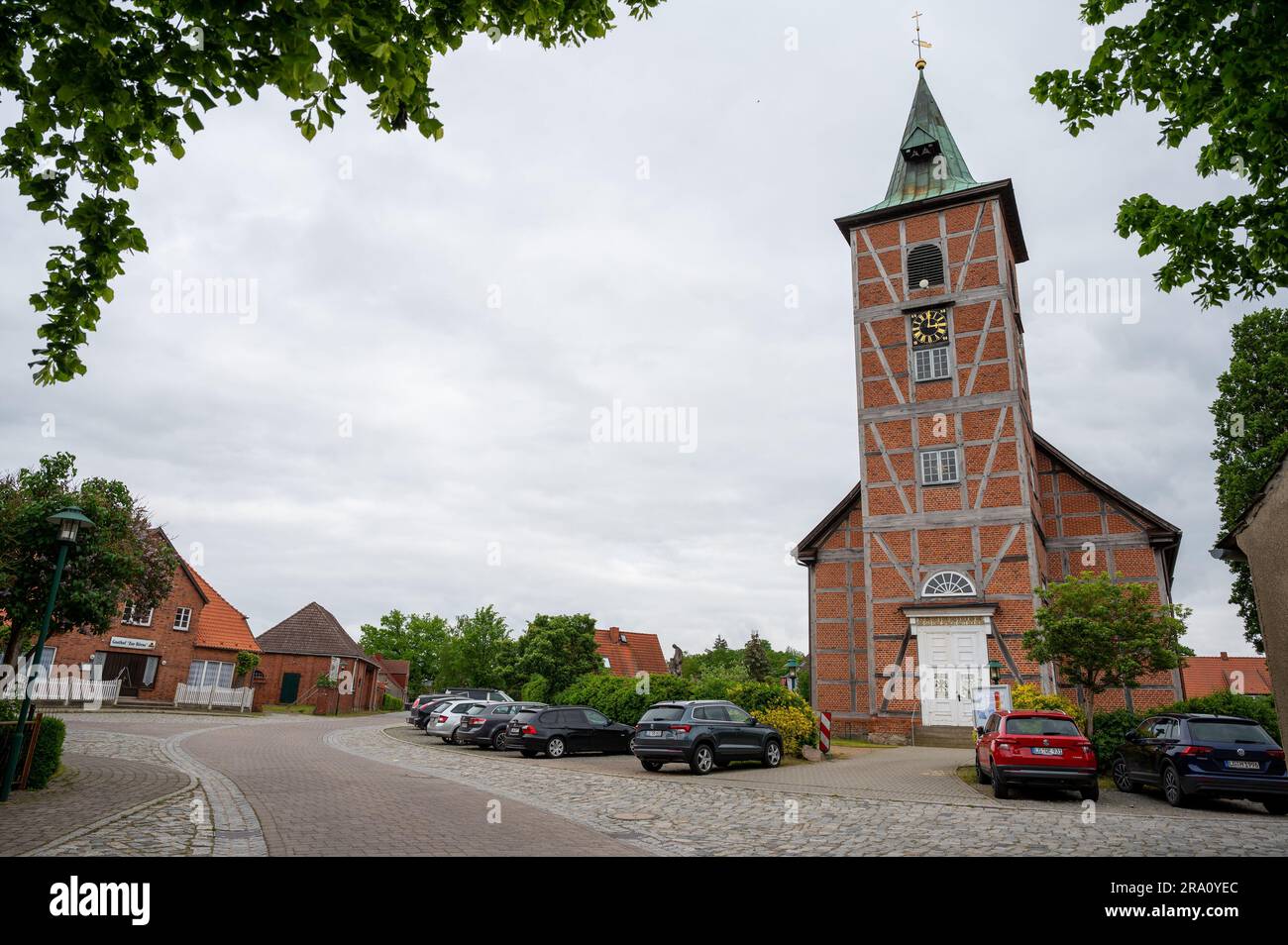PRODUCTION - 24 May 2023, Lower Saxony, Amt Neuhaus: The church of the village. The end of June marks the 30th anniversary of the day when Amt Neuhaus and parts of the town of Bleckede were reincorporated into the district of Lüneburg. Since 1993 the Amt Neuhaus and parts of the town Bleckede belong again to the district Lüneburg. During the German division, the towns on the right bank of the Elbe were part of the GDR. After the German reunification the unification took place. On June 30, 1993, the reincorporation of the municipality of Amt Neuhaus and the districts of Neu Bleckede and Neu Wen Stock Photo