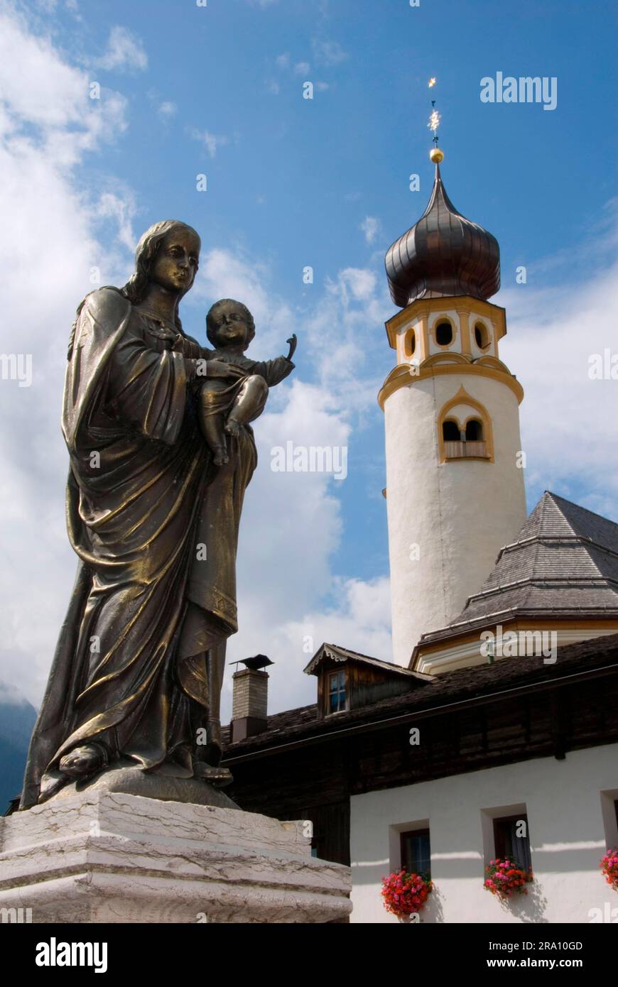 Fountain figure in front of St. Michael's Church, San Candido, Michaelis, San Candido, Trentino-Alto Adige, South Tyrol, Italy Stock Photo