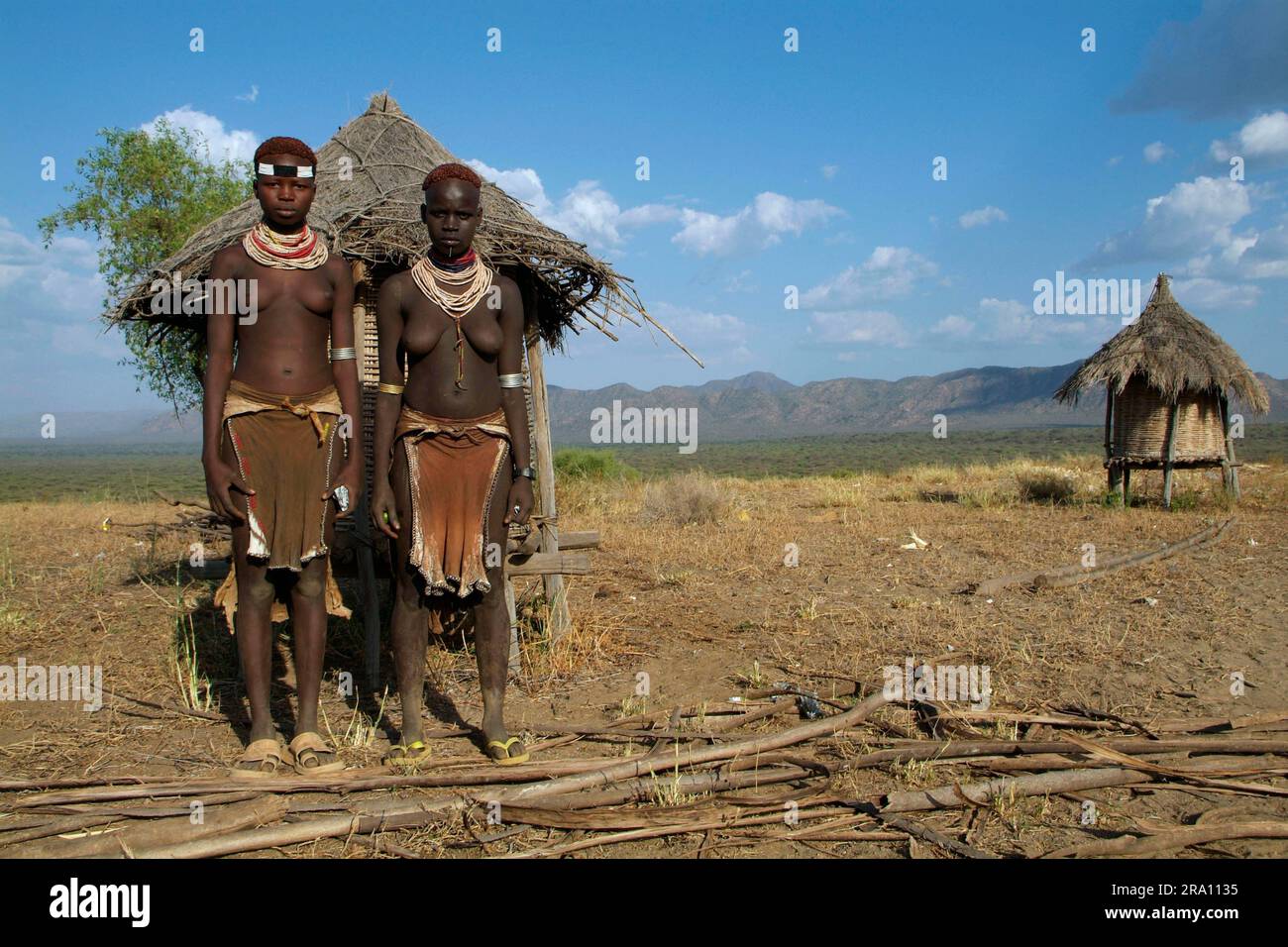 Girl in front of granary, Karo tribe, southern Ethiopia Stock Photo