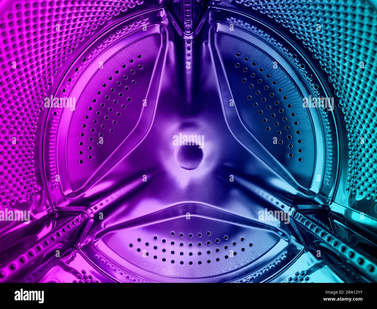 Washing machine drum close up. Washing machine background. Inside the