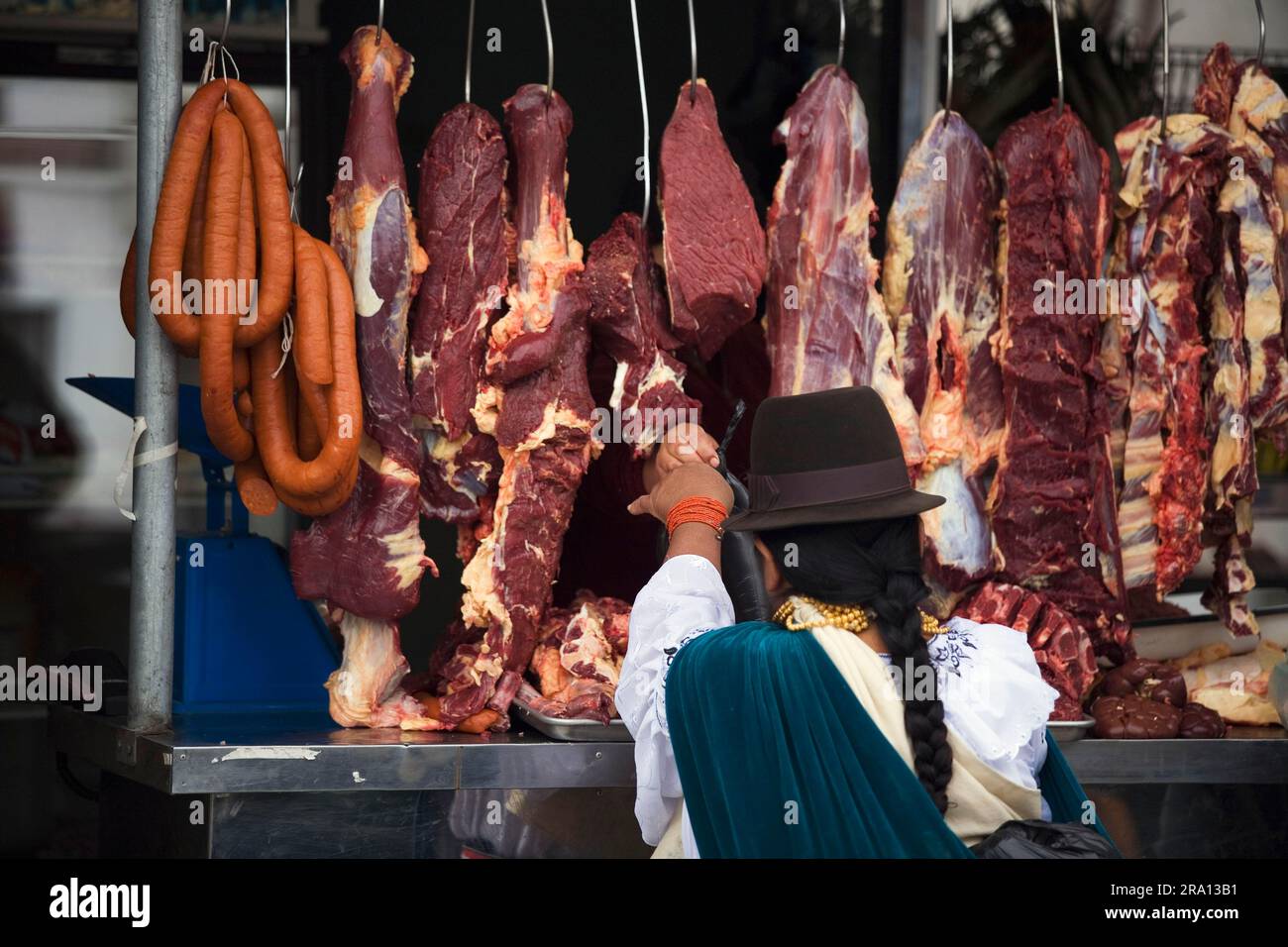 Woman buying meat, butcher's stall at market, Otavalo, Imbabura province, Ecuador, butcher, meat stall Stock Photo