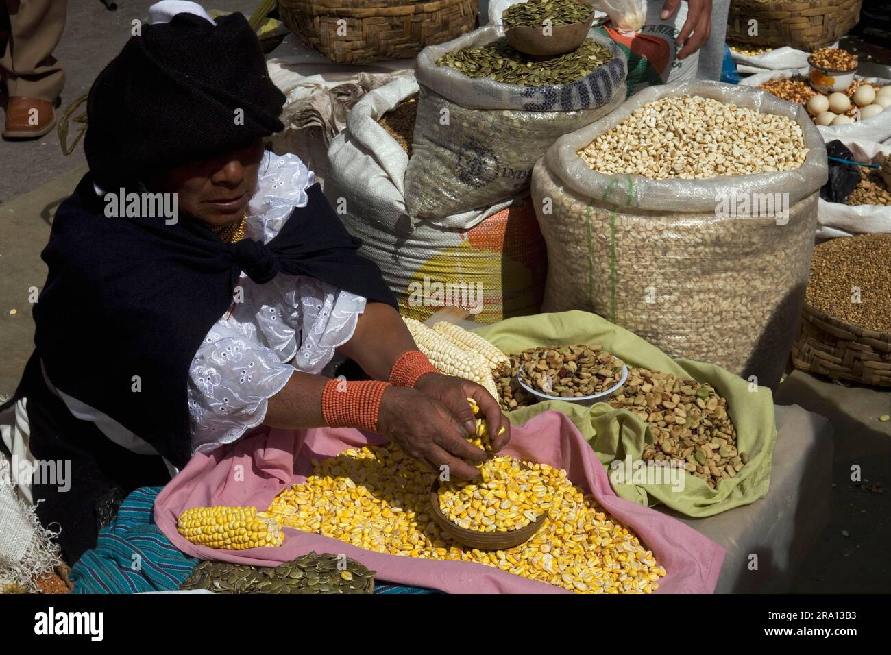 Woman selling corn, market, Otavalo, Imbabura province, Ecuador Stock Photo