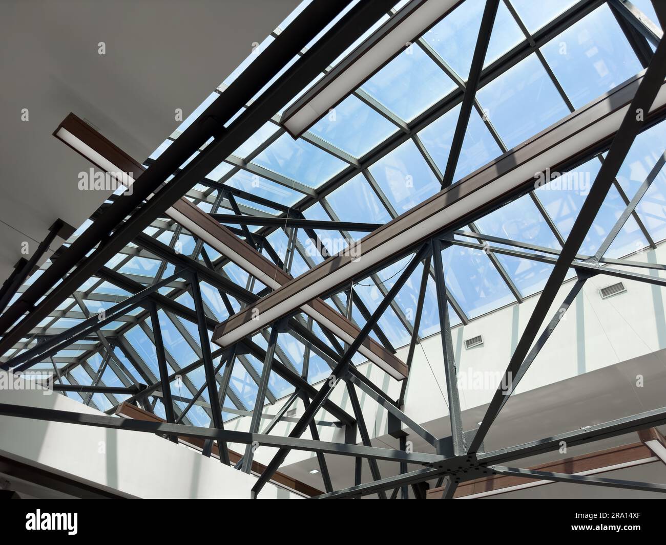Lights and ventilation system in long line on ceiling of the industrial ...