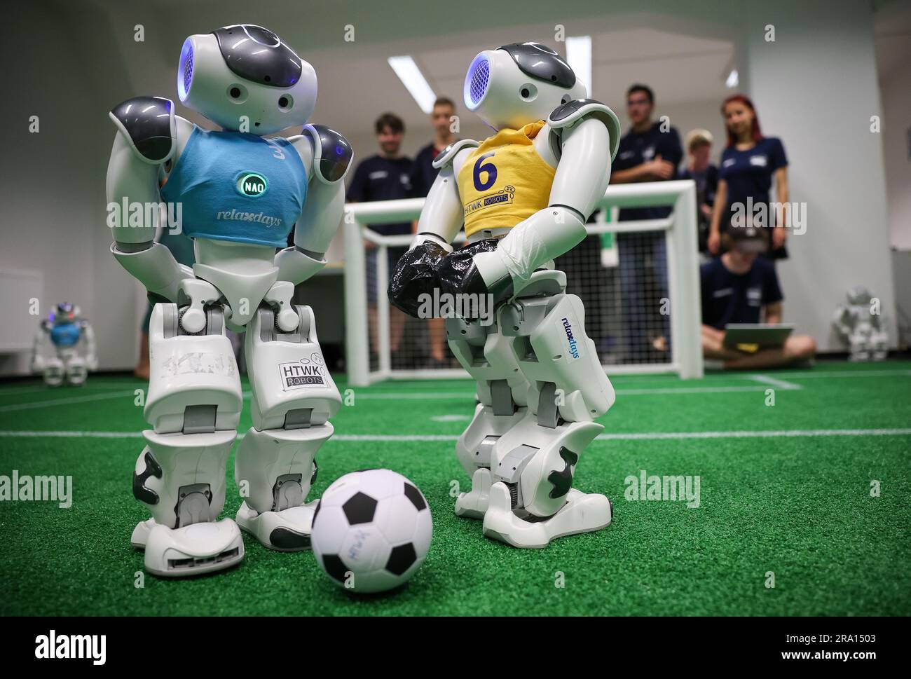 Leipzig, Germany. 28th June, 2023. Nao robots play soccer during a training game in a laboratory at the Leipzig University of Applied Sciences (HTWK). Having already become world champions in robot soccer in 2018, the Leipzig team is aiming to secure the title again this year. Starting July 5, robots playing soccer will face off in a World Cup in Bordeaux, France. Credit: Jan Woitas/dpa/Alamy Live News Stock Photo