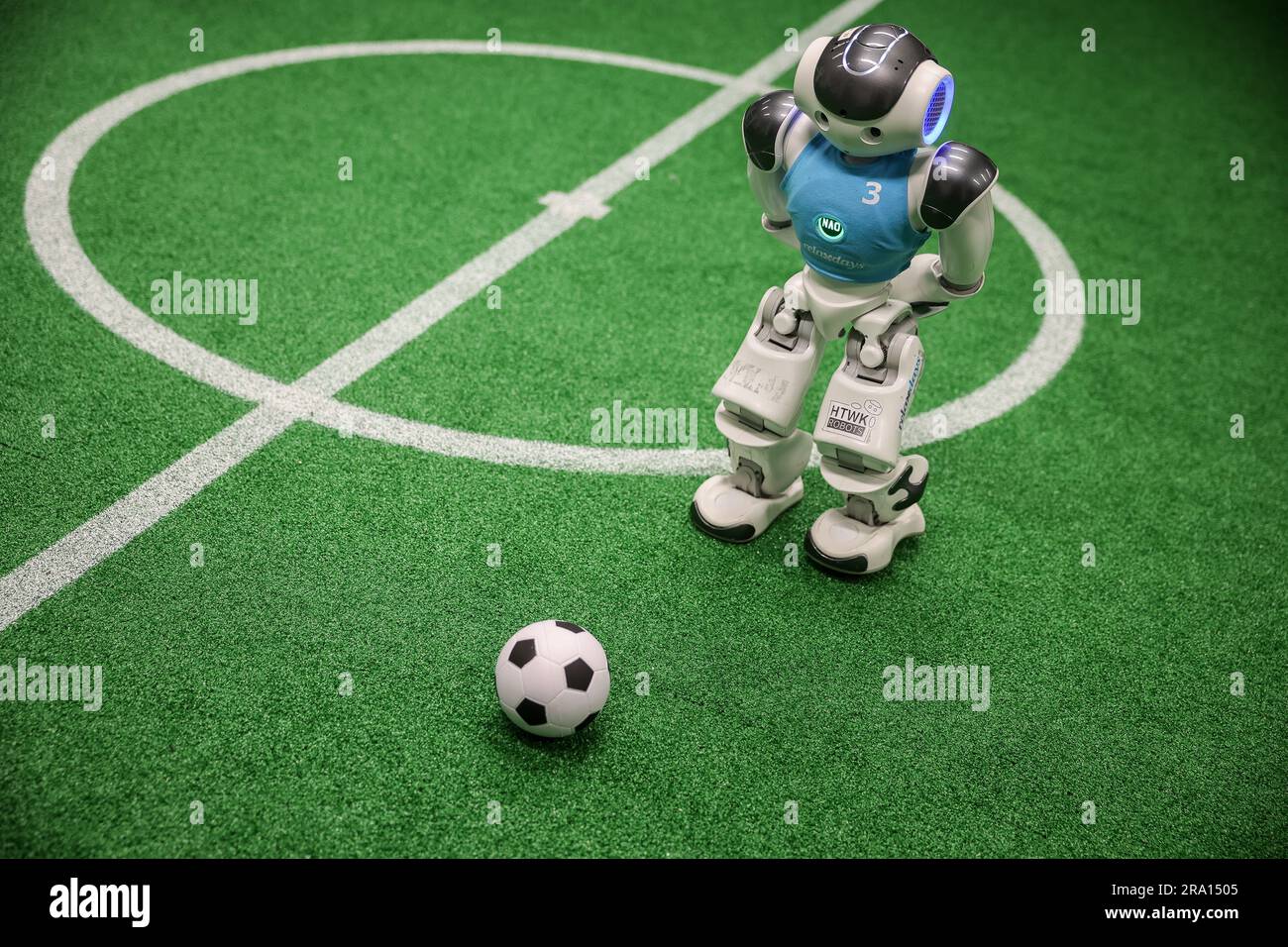 Leipzig, Germany. 28th June, 2023. A Nao robot plays soccer during a training game in a laboratory at the Leipzig University of Applied Sciences (HTWK). Having already become world champions in robot soccer in 2018, the Leipzig team is aiming to secure the title again this year. Starting July 5, robots playing soccer will face off in a World Cup in Bordeaux, France. Credit: Jan Woitas/dpa/Alamy Live News Stock Photo