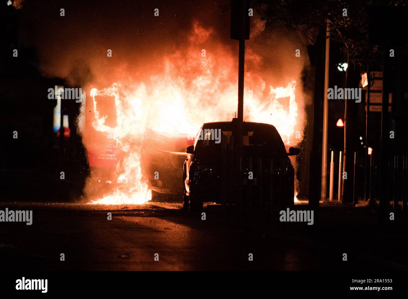 Argenteuil, France, 29/06/2023, A car burns during protests in Argenteuil, Paris outskirts, France on June 29, 2023, three days after a teenager was shot dead during a police traffic stop in the Paris suburb of Nanterre. Protests over the fatal police shooting of a teenager rocked France for a third straight night on June 29, with cars burned, buildings vandalised and hundreds arrested in cities across the country. The nighttime unrest followed a march earlier on Thursday in memory of the 17-year-old, named Nahel, whose death has revived longstanding grievances about policing and racial profil Stock Photo