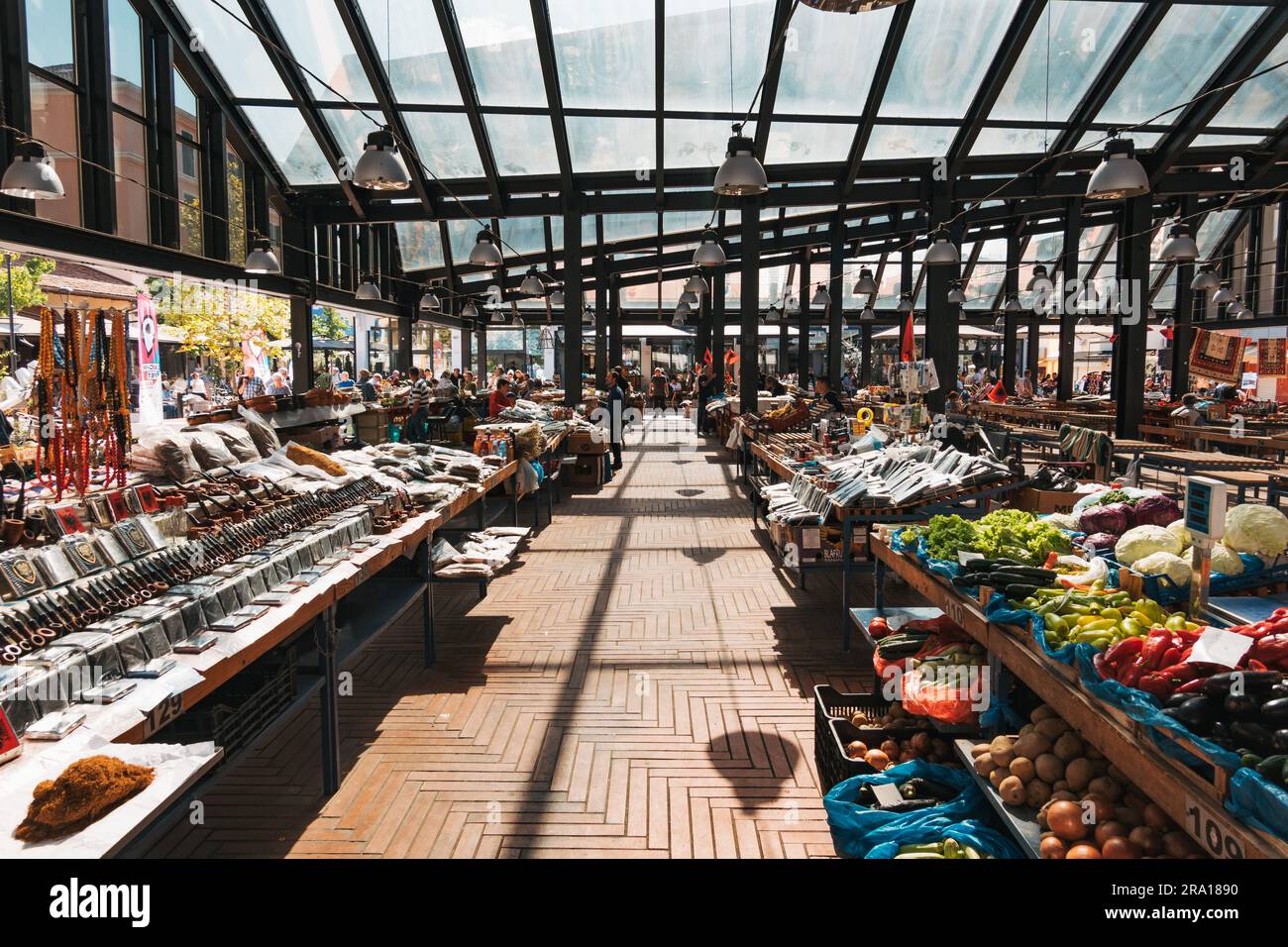 Produce and household goods and souvenirs for sale at the New Bazaar (Pazari i Ri), a glass-covered market in Tirana, Albania Stock Photo