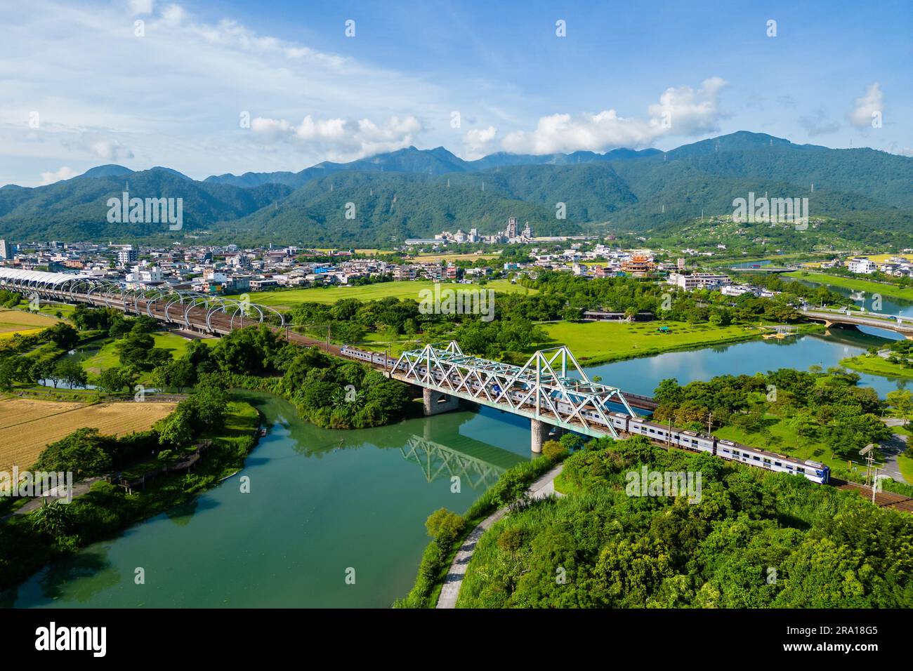 Train pass the iron bridge at dongshan river eco park in yilan, taiwan
