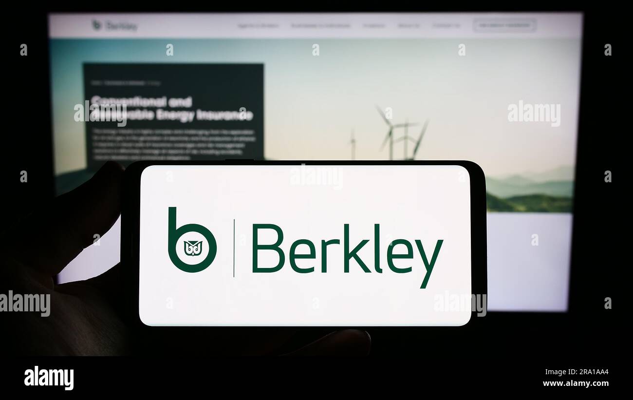 Person holding smartphone with logo of US insurance company W. R. Berkley  Corporation on screen in front of website. Focus on phone display Stock  Photo - Alamy