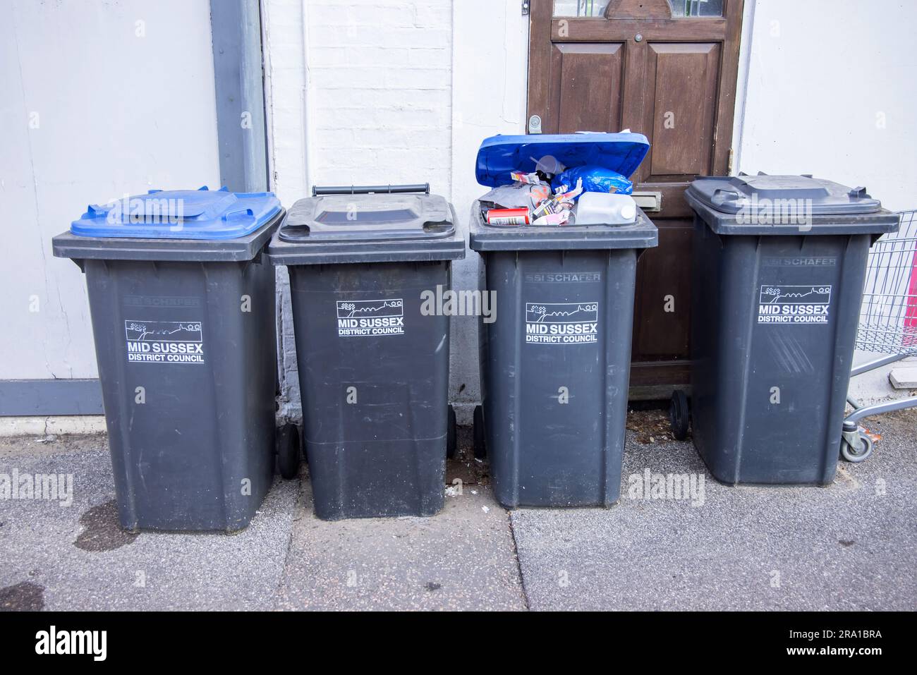 overflowing rubbish bins in Burgess hill Mid Sussex Stock Photo Alamy