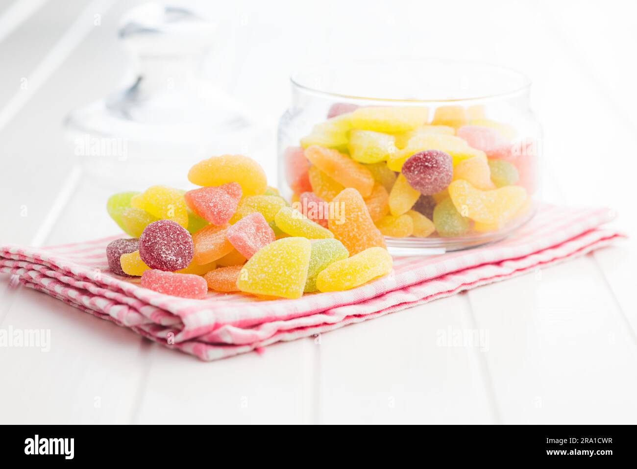 Mix of fruity jelly candy on the checkered napkin. Stock Photo
